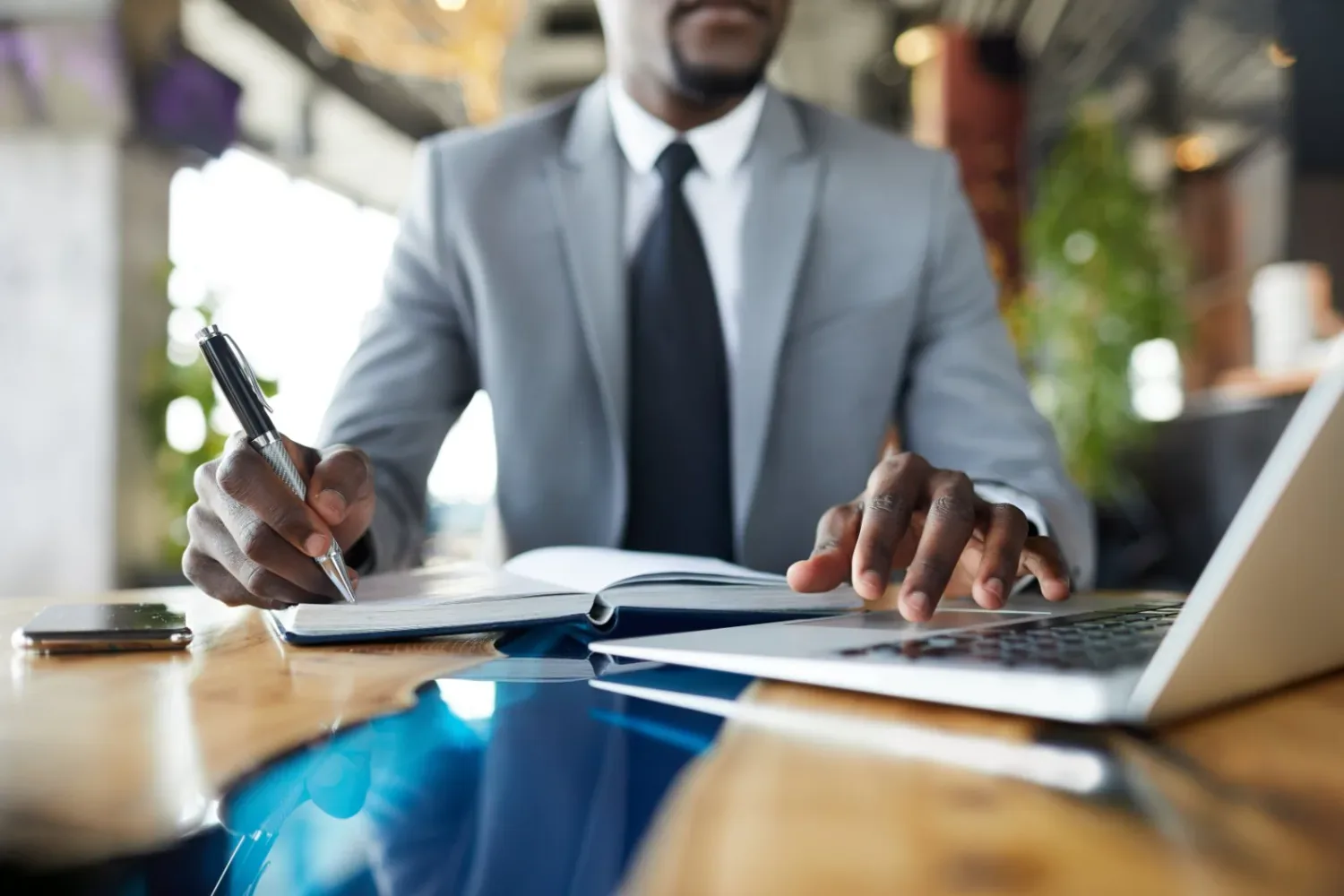 A commercial professional working through a business plan at their desk